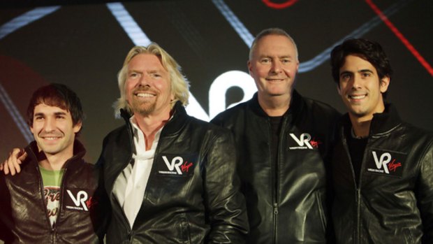Richard Branson (second from left) with the Virgin Racing team.