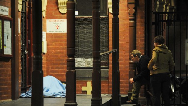 Census workers interview a homeless person in St Kilda in 2011.