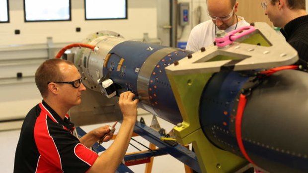 The University of Queensland Scramspace team reparing the payload for launch.