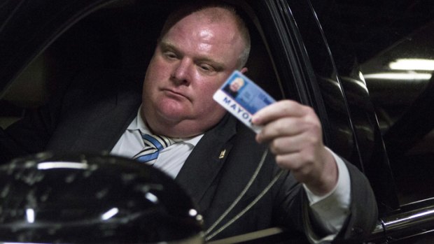 Rob Ford leaves Toronto's City Hall after fronting the media.