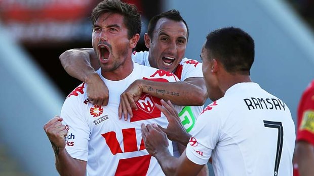 Heart's Harry Kewell celebrates after converting a penalty against Adelaide.
