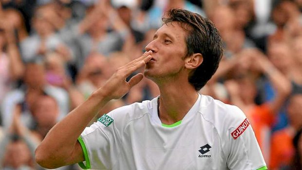 Ukraine's Sergiy Stakhovsky celebrates beating Switzerland's Roger Federer during their second round men's singles match at Wimbledon.