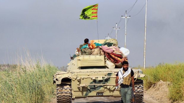 Shiite Popular Mobilisation forces prepare to attack Islamic State positions at Khalidiya Island in Anbar province, Iraq, in August.