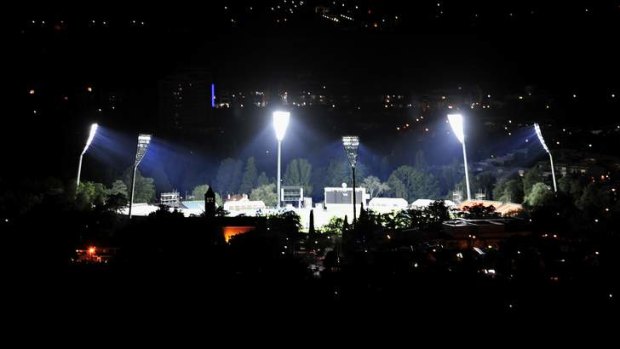 The lights at Manuka oval are turned on for the first time.
