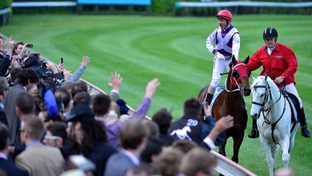 Glen Boss salutes the crowd after winning the Cox Plate on Ocean Park.