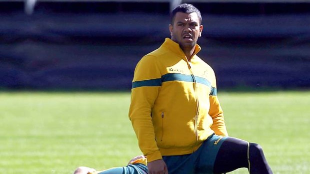 In doubt ... Kurtley Beale stretches at Wallabies training this morning in Auckland.