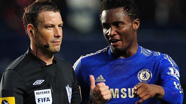 John Obi Mikel of Chelsea talks to referee Mark Clattenburg.
