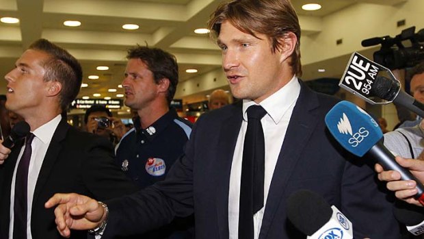Heading home: Cricket vice-captain Shane Watson arrives back at Sydney airport after his suspension.