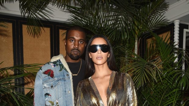 Kanye West with wife Kim Kardashian West at Paris Fashion Week in September, just a few days before she was robbed at gunpoint. 