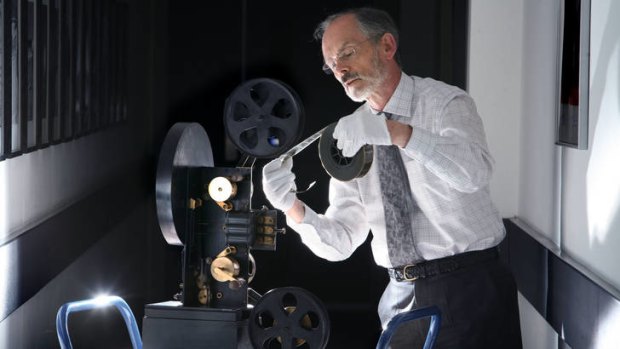 Michael Harvey, curator of cinematography at the National Media Museum in Bradford, England, with a colour projector.