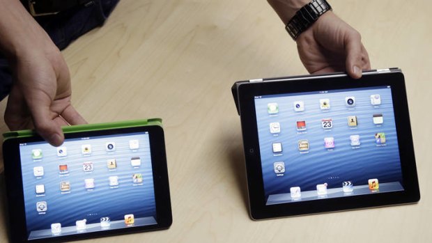 Compare the difference: the iPad mini, left, and the iPad4.
