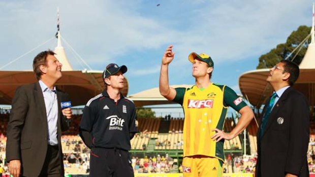 Cameron White wins the toss in the Twenty20 match against  England on Wednesday.