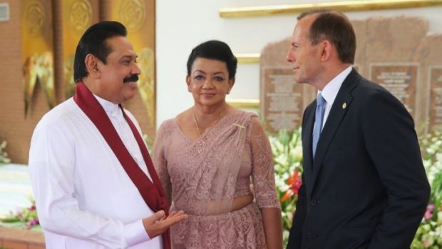 All smiles: Mr Abbott with Sri Lankan President Mr Mahinda Rajapaksa and his wife.