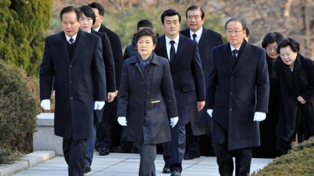 Paying respects: South Korea's conservative President Park Geun-hye (centre) visits the grave of her father, Park Chung-hee, the country's former military ruler at the National Cemetery in Seoul on December 20, 2012.