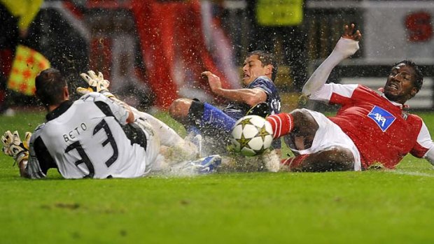 On the slide: Javier Hernandez (centre) challenges Braga goalkeeper Beto (left) and defender Douglao.