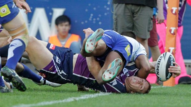 Ryan Hoffman crashes over for the first try of the grand final.