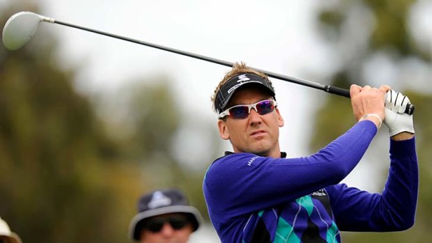 Purple patch: Colourful Briton Ian Poulter gets the feel of Victoria golf club yesterday in his search for a gold jacket.