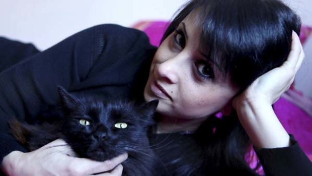 Purr-fect... Gina Guirguis with Bella. A parasite carried by cats can make women affectionate.