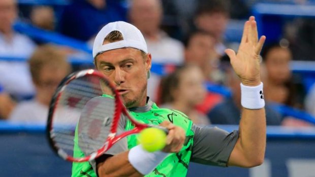 Lleyton Hewitt has been knocked out of the Washington Open by Milos Raonic.