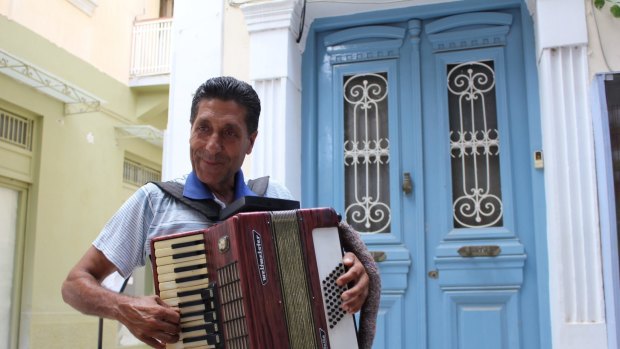 Local colour: A street musician adds to Nafplio's atmosphere.