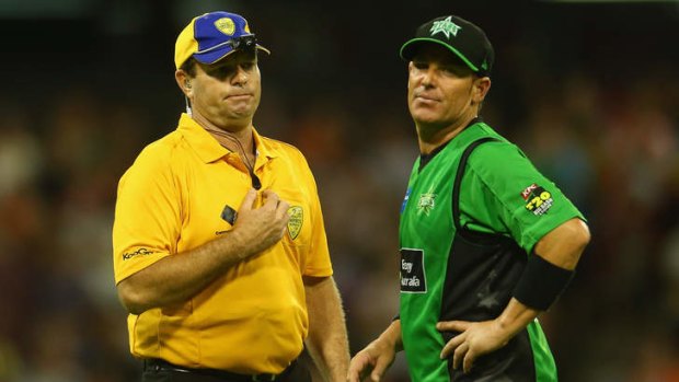 Shane Warne of the Stars has words with the umpire after James Faulkner bowled a no-ball of the last ball during the Big Bash League semi-final.