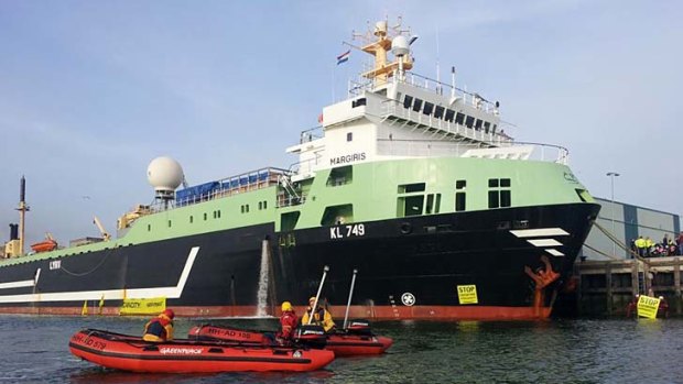 The supertrawler Margiris is locked down by Greenpeace activists in the Dutch port of Ijmuiden today.