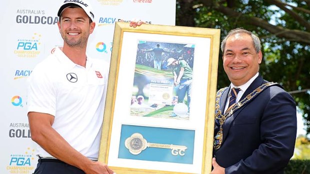 Local hero: Gold Coast mayor Tom Tate presents Adam Scott the Key to the City at Royal Pines on Wednesday.