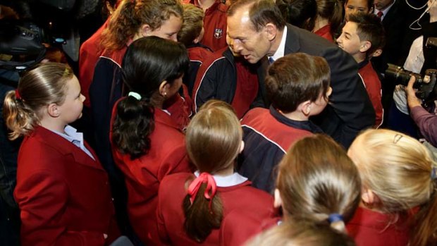 Opposition Leader Tony Abbott talks to students at the Penrith Christian School.