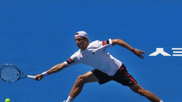 Fighter ... Matthew Ebden stretches for a forehand yesterday. Ebden's three-set loss to Marcos Baghdatis to end Australian involvement in the singles competitions.