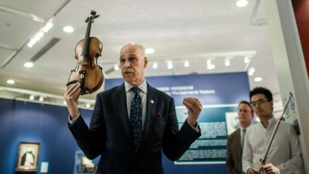 'Exceptional' instrument ... A Stradivarius violin once owned by French violinist Rodolphe Kreutzer, who lived from 1766 to 1831,  is presented to the press by Christie's auction house in Hong Kong.
