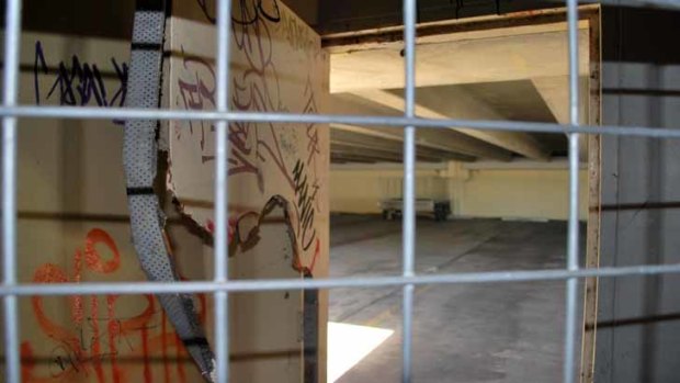 The top levels of the car park, which is significantly marked with graffiti, were closed off to curb antisocial behaviour.