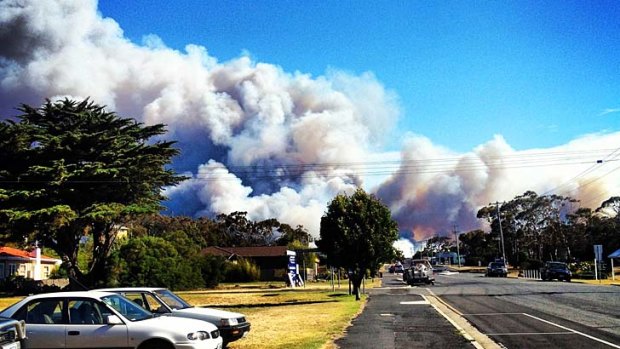 Thick smoke covers the sky outside the town of Bicheno, one of at least 25 fires burning in Tasmania.