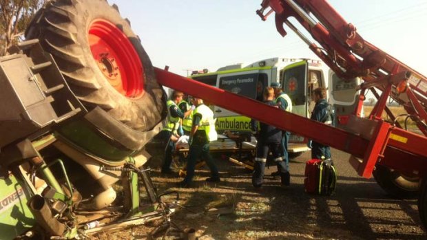 A crushed tractor at Milmerran, on the Darling Downs. A trapped man had to be cut from the cabin.