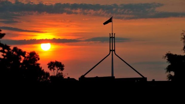 The sun sets over Parliament House in Canberra.