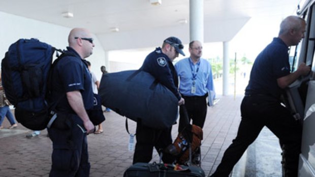 Australian police investigators arrive in Port Moresby.
