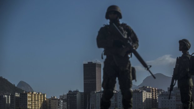 Military soldiers stand guard in Rio de Janeiro, Brazil.