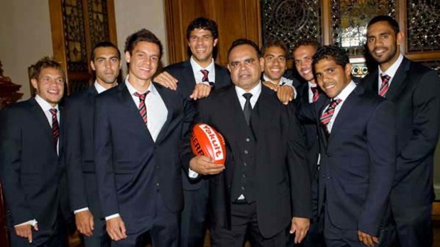 Essendon's midfield magician Michael Long is flanked by current indigenous Bombers (from left) Leroy Jetta, Courtenay Dempsey, Anthony Long, Paddy Ryder, Jarrod Atkinson, Mark Williams, Alwyn Davey and Nathan Lovett-Murray at the club's Hall of Fame last night.
