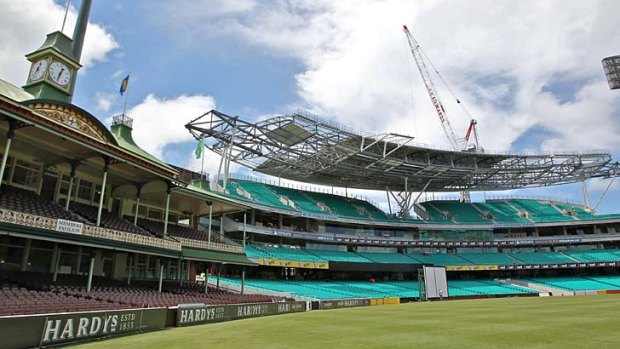 Stands won't deliver: The old and the not-so-completed new stands, where some members may be without shelter, at the Sydney Cricket Ground.