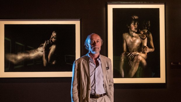 Bill Henson with some of the works in the NGV exhibition.