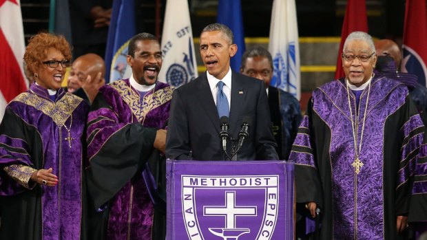 President Barack Obama sings 'Amazing Grace' as he delivers the eulogy for South Carolina state senator and Reverend Clementa Pinckney during Pinckney's funeral service in Charleston, South Carolina.