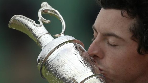 Sweet victory: Rory McIlroy kisses the Claret Jug after his two-shot win in the Open at Royal Liverpool.