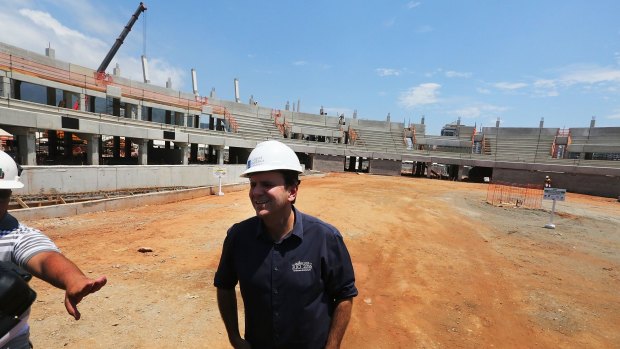 Rio Mayor Eduardo Paes inspects construction work at the Olympic Park's Tennis Centre in December.