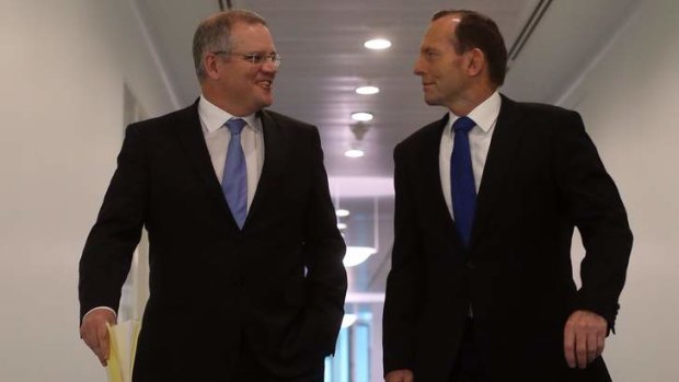 Immigration Minister Scott Morrison, pictured with Prime Minister Tony Abbott, says it's cheaper to offer voluntary return packages than to keep asylum seekers in detention centres or on bridging visas.