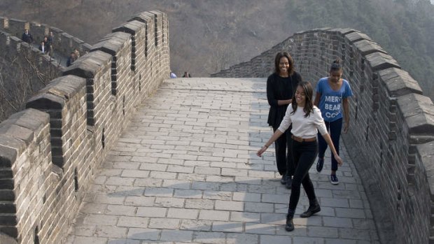 US first lady Michelle Obama and her daughters Malia, front, and Sasha as they visit the Mutianyu section of the Great Wall of China in Beijing.