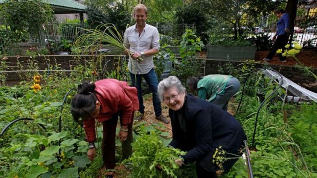 Campaign: Bill Granger with Redfern residents in their market garden.