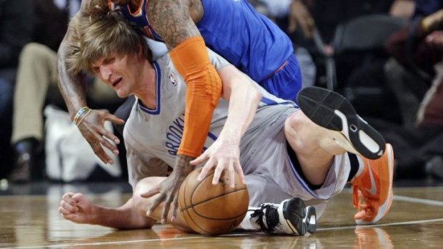 Brooklyn Nets forward Andrei Kirilenko scrambles for control of the ball in New York.