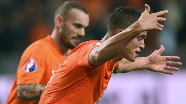 Late blitz: Ibrahim Afellay celebrates his goal for the Dutch.