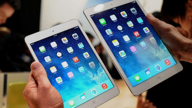 The new iPad Mini, left, and the iPad Air.