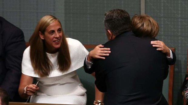 Treasurer Joe Hockey is congratulated by his wife Melissa Babbage and his son Xavier after handing down the Budget.