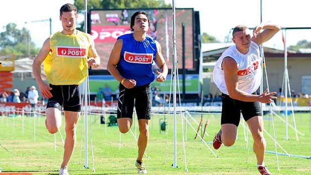 Mitchell Williams (far right) stumbles across the finish line to win the Stawell Gift.